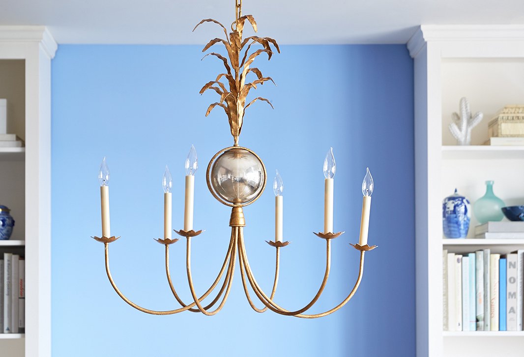 With leafy accents and candle-inspired lights, Visual Comfort’s Gramercy Chandelier makes an elegant statement.
